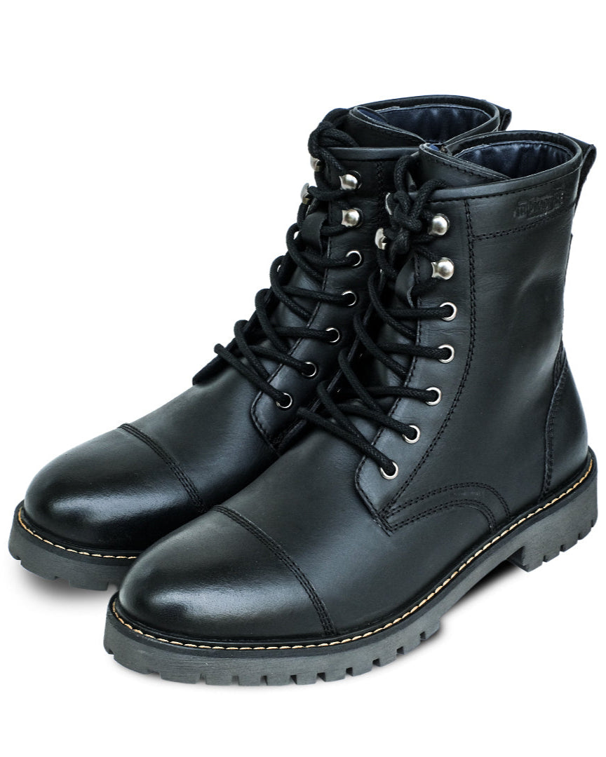 Pair of black leather boots on a white background