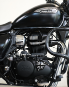 Close-up of a Royal Enfield motorcycle engine with the brand logo visible.