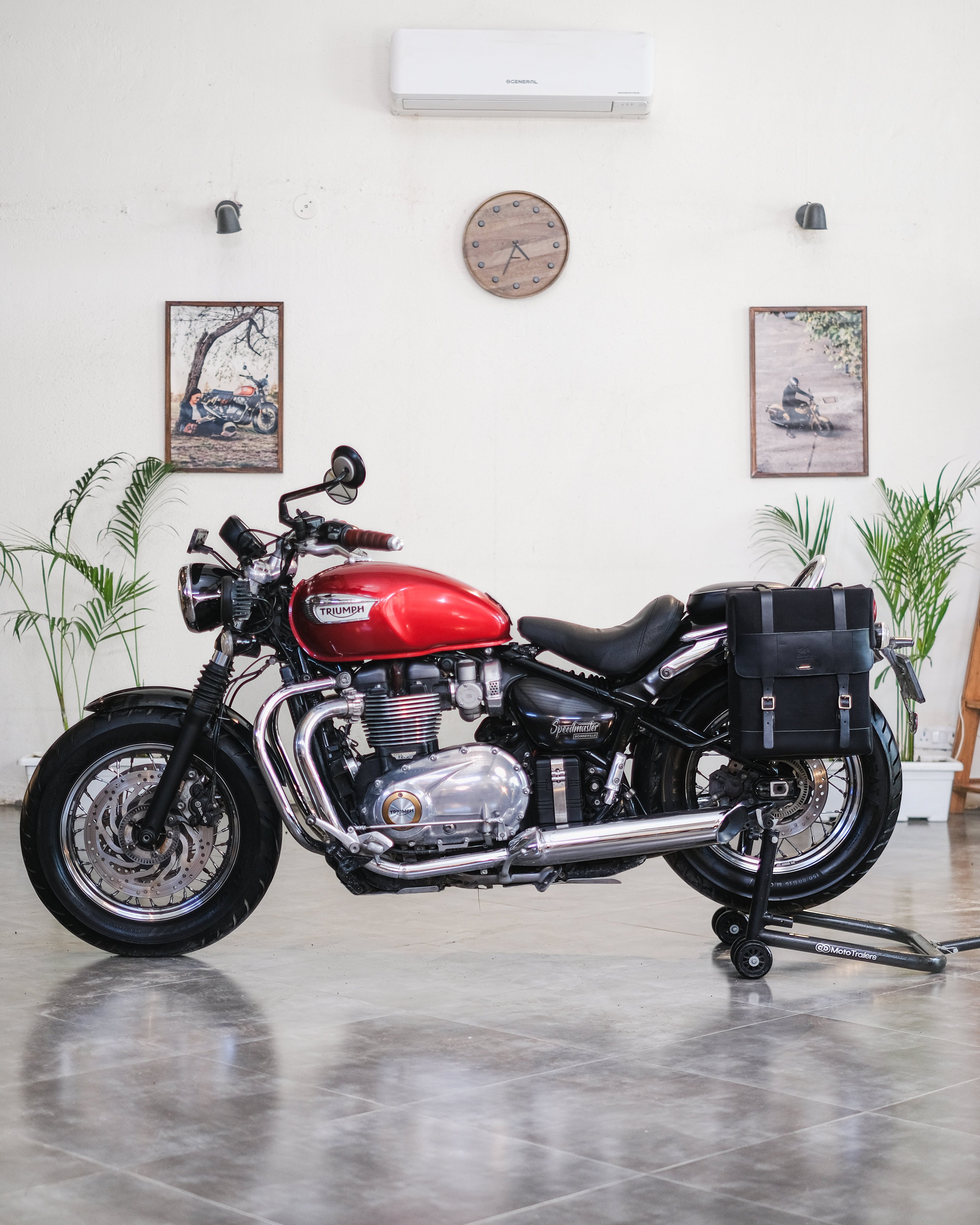 Red motorcycle in a room with Saddlebag on it
